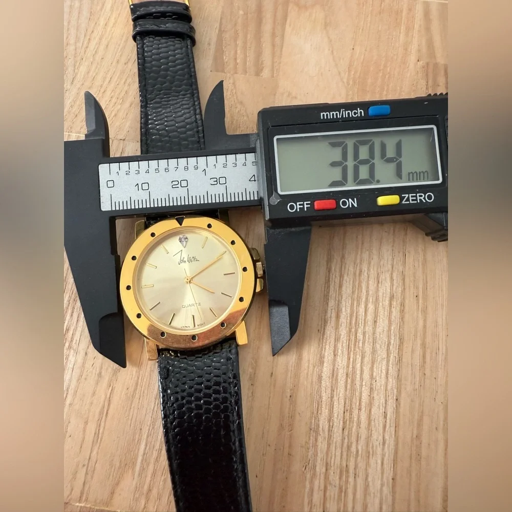 Vintage John weitz gold tone black leather watch NEW BATTERY